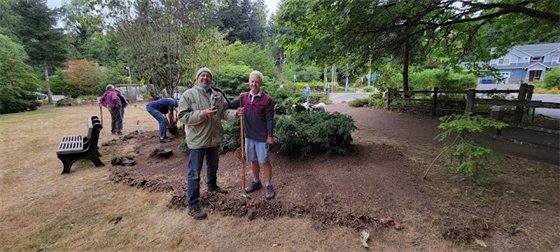 Rotary Club members working in the pollinator garden at Pfingst Animal Acres Park