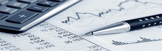 pen and calculator on top of paper budget