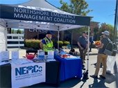 NEMCo volunteers staffing a booth at National Night Out in Kenmore