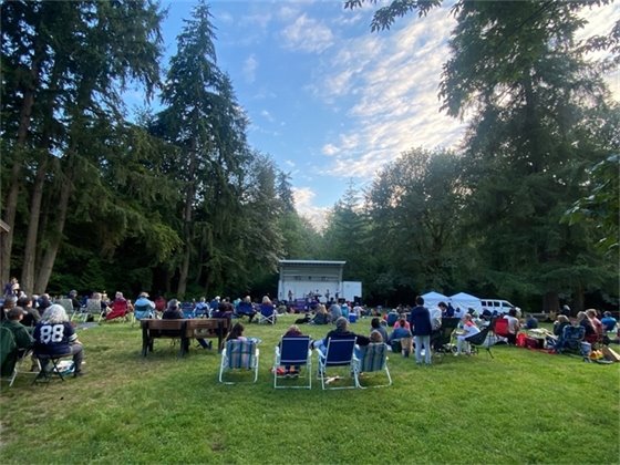 Pfingst Animal Acres Park with concert attendees sitting on lawn 2022 event