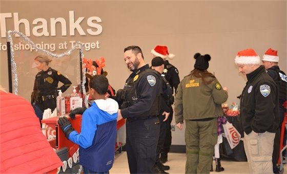 Child shopping at Target with police officers for Shop with a Cop event