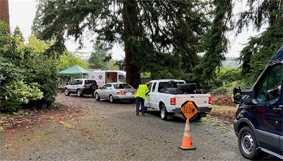 Photo with cars in line for a previous recycling event