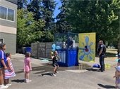 Children throwing towards a dunk tank