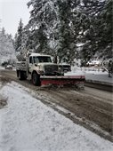 Snowplow working on city street