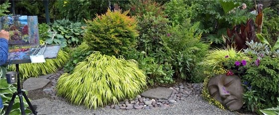 Garden scene with plein air artist and sculpture face